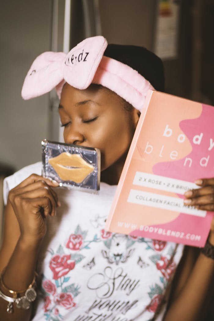 creative-01 African American woman enjoying a skincare routine indoors with Bodyblendz collagen kit.