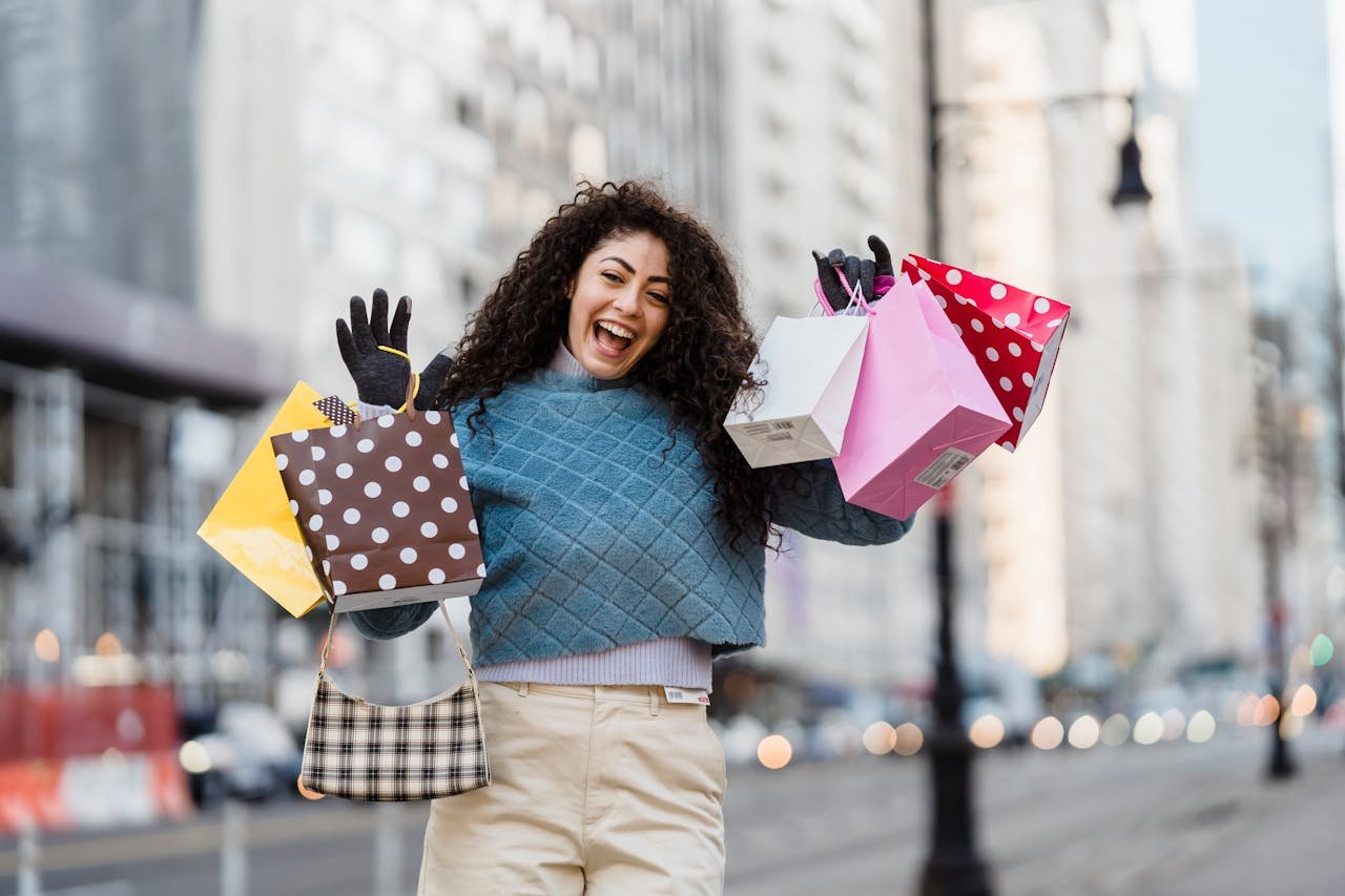 creative-03 Happy woman with shopping bags, smiling in an urban setting. Vibrant city life captured in a candid moment.